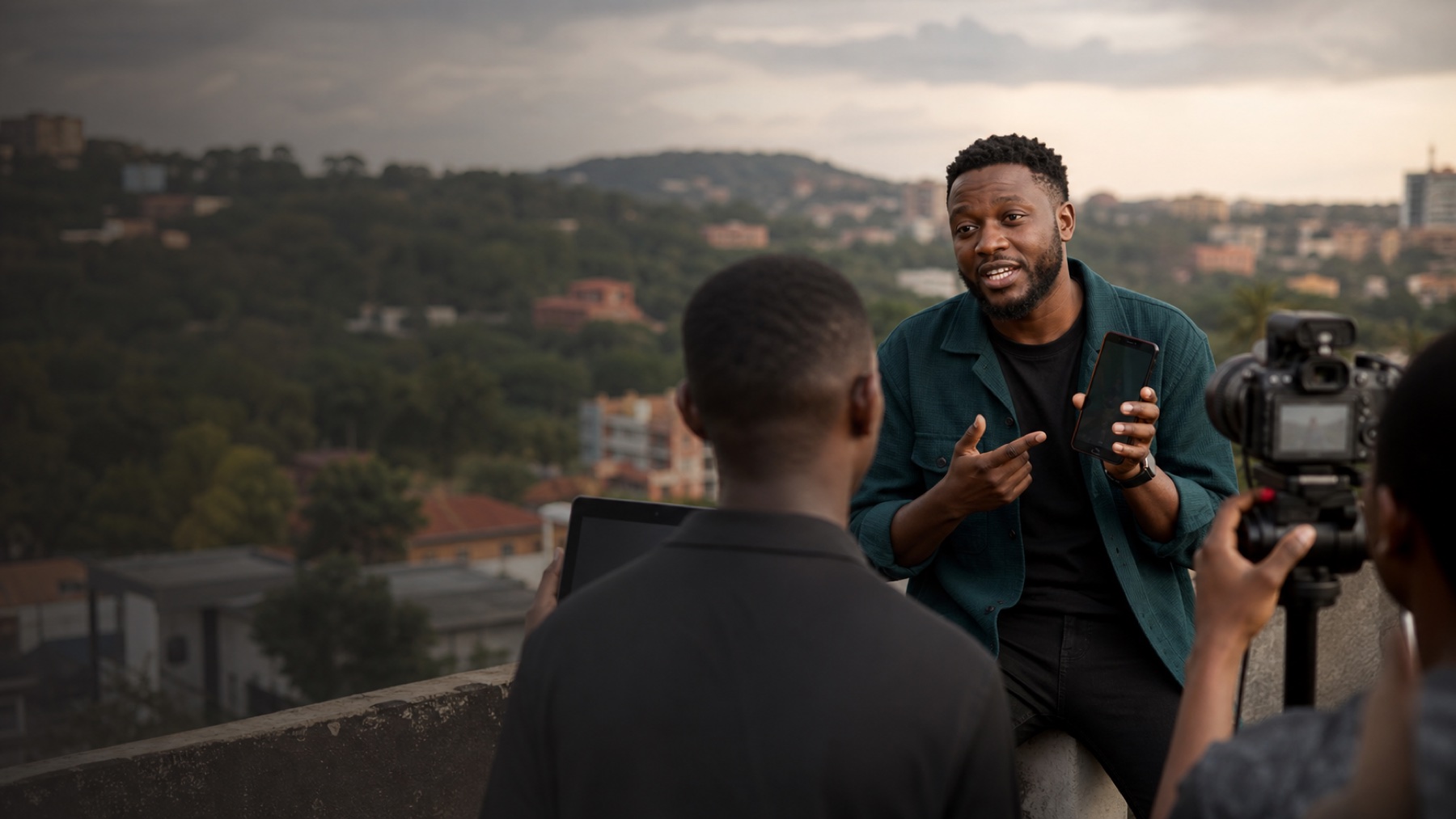 Ugandan technology creator filming a practical smartphone explainer in Kampala